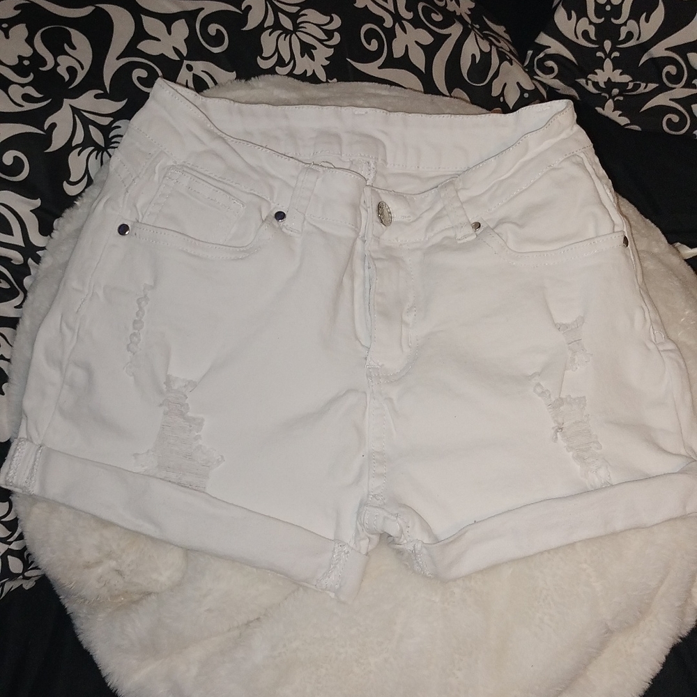 I am selling a pair of white "jean" shorts. In perfect condition! Size Medium